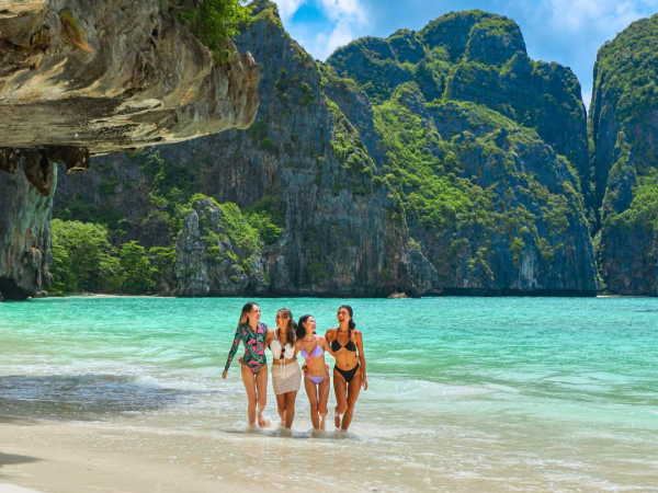 Travelers relaxing during the Phi Phi and Maiton Island catamaran tour