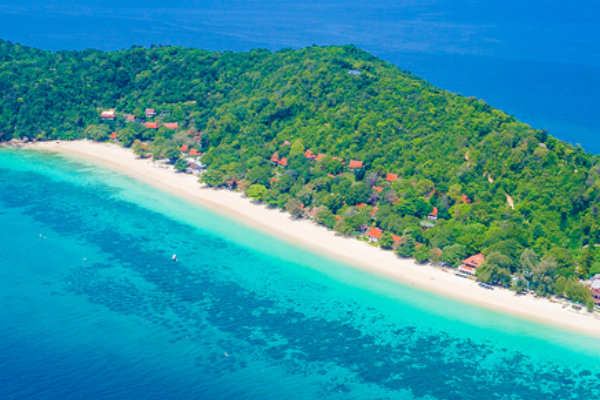 Catamaran departing across the sea toward Maiton Island during the Phi Phi and Maiton Island tour from Phuket