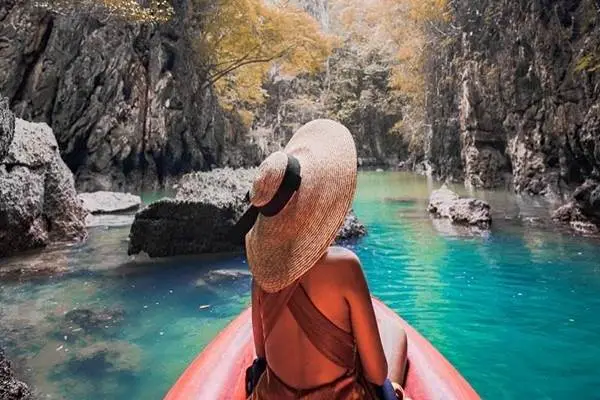 Sea cave canoeing during a James Bond Island Tour by luxury catamaran in Phang Nga Bay