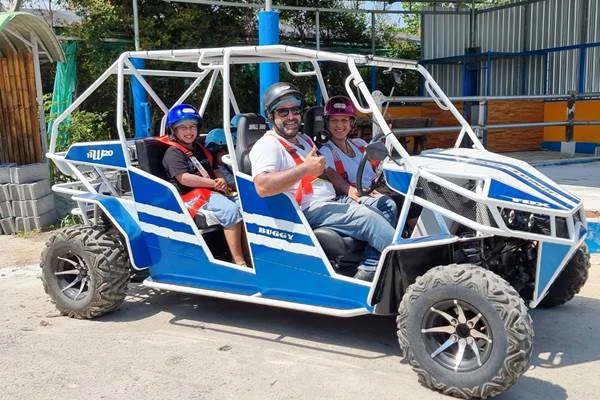 Buggy to Big Buddha Phuket tour with tourists riding a blue buggy