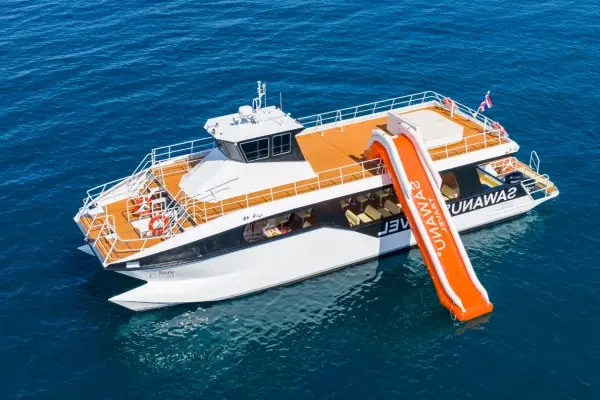 Two-floor Phi Phi power catamaran with orange water slide in the Andaman Sea