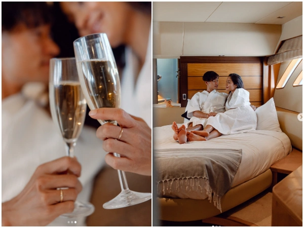 Couple celebrating with sparkling wine in a private cabin on the Phi Phi luxury yacht