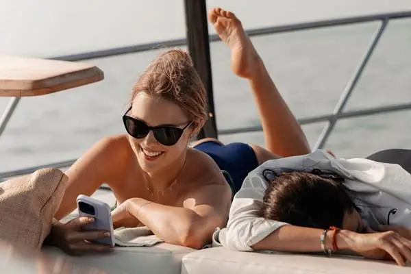 Two guests relaxing on the sun deck of the Phi Phi luxury yacht