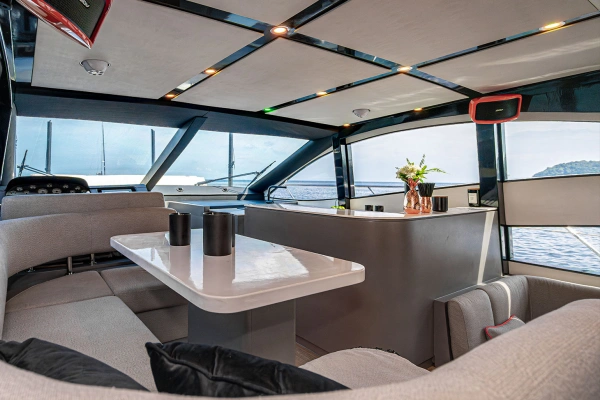 Comfortable indoor lounge with panoramic sea views on the Phi Phi luxury yacht