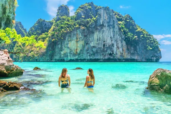 Travelers swimming in the turquoise water at Pileh Lagoon during the Phi Phi Island Late Morning Tour