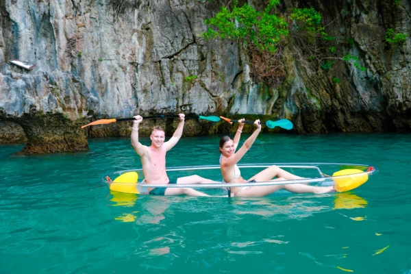 Guests enjoying a clear kayak activity during the Phi Phi late morning catamaran tour