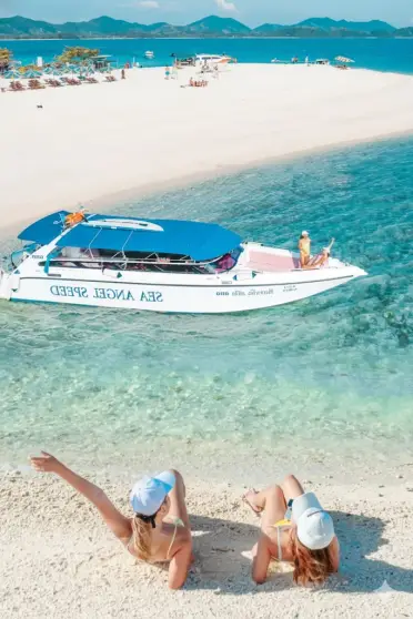 Phi Phi Maya Bay and Khai Island speedboat tour with travelers relaxing on a white-sand beach