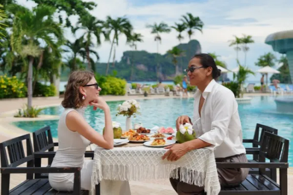 Guests dining beside the hotel pool on Phi Phi Don during Phi Phi James Bond Krabi 2 day tour