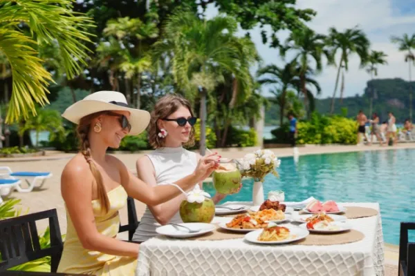 Guests enjoying lunch at Phi Phi Don during the Phi Phi Island luxury catamaran tour