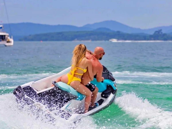 Phuket jet ski tour guests riding near island scenery