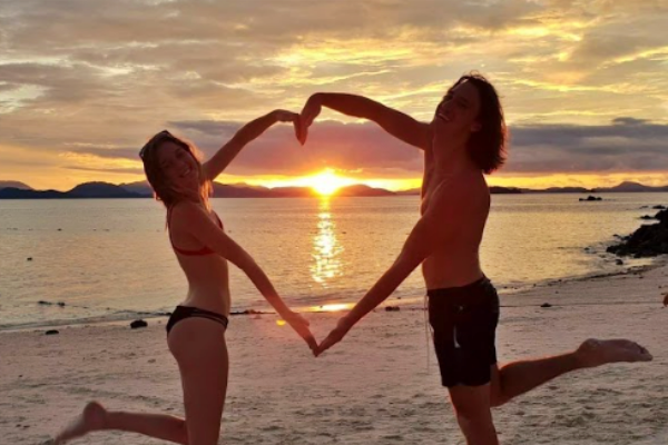 Couple enjoying a romantic beach sunset during the Phi Phi Island Sunset Tour from Phuket