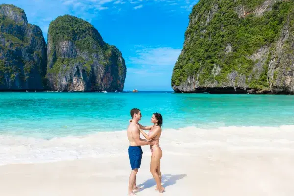 Couple enjoying Maya Bay during the Phi Phi Catamaran with Slide tour from Phuket