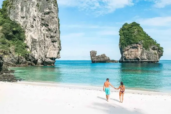 White-sand beach and limestone scenery near Nui Bay during the Phi Phi Island Sunrise Tour from Phuket