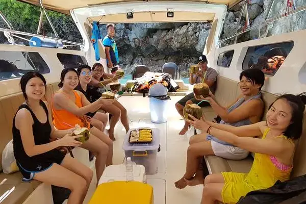 Guests relaxing inside a speedboat during the Phi Phi Island Sunrise Tour