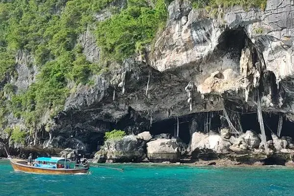 Viking Cave and limestone cliffs on Phi Phi Leh during the Phi Phi Island Sunset Tour from Phuket
