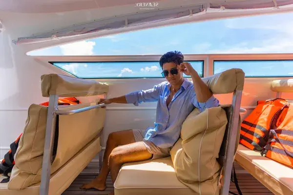 Passenger relaxing in the comfortable cabin of the PP3 Phi Phi Luxury Speed Catamaran Tour
