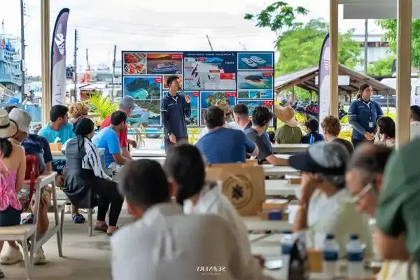 Tour guide giving a safety briefing before the PP3 Phi Phi Luxury Speed Catamaran Tour from Phuket