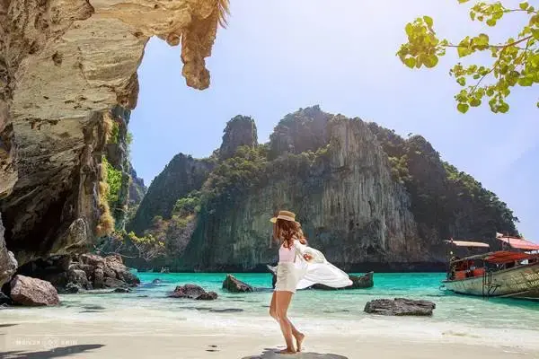 Travelers relaxing at a tropical island stop during the Phi Phi Island speedboat tour from Phuket
