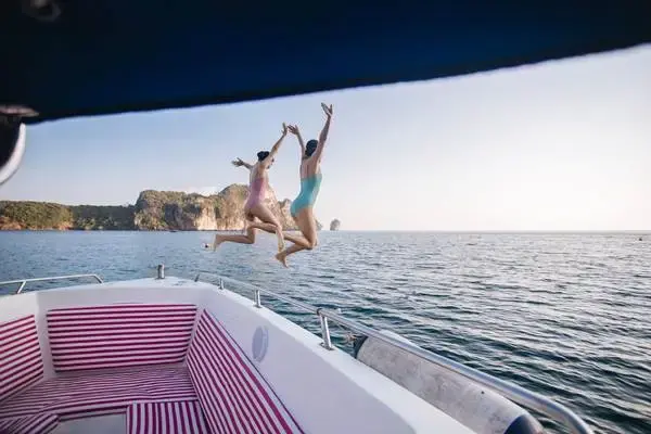 Travelers enjoying the sea before departing the Phi Phi Islands for Phuket by speedboat