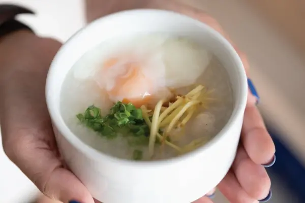 Hot rice porridge served during pier check-in before the Phi Phi Island cruise