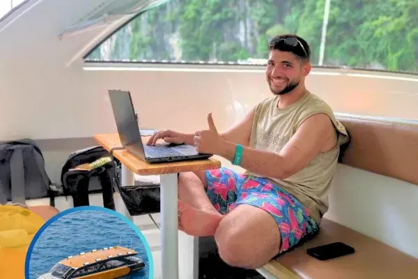 Passenger relaxing inside a speed catamaran during the return journey to Phuket