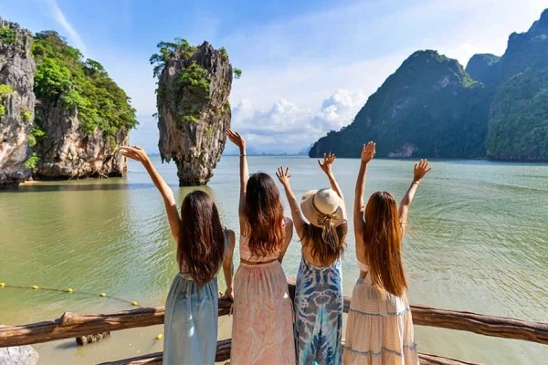 Travelers visiting James Bond Island in Phang Nga Bay Thailand