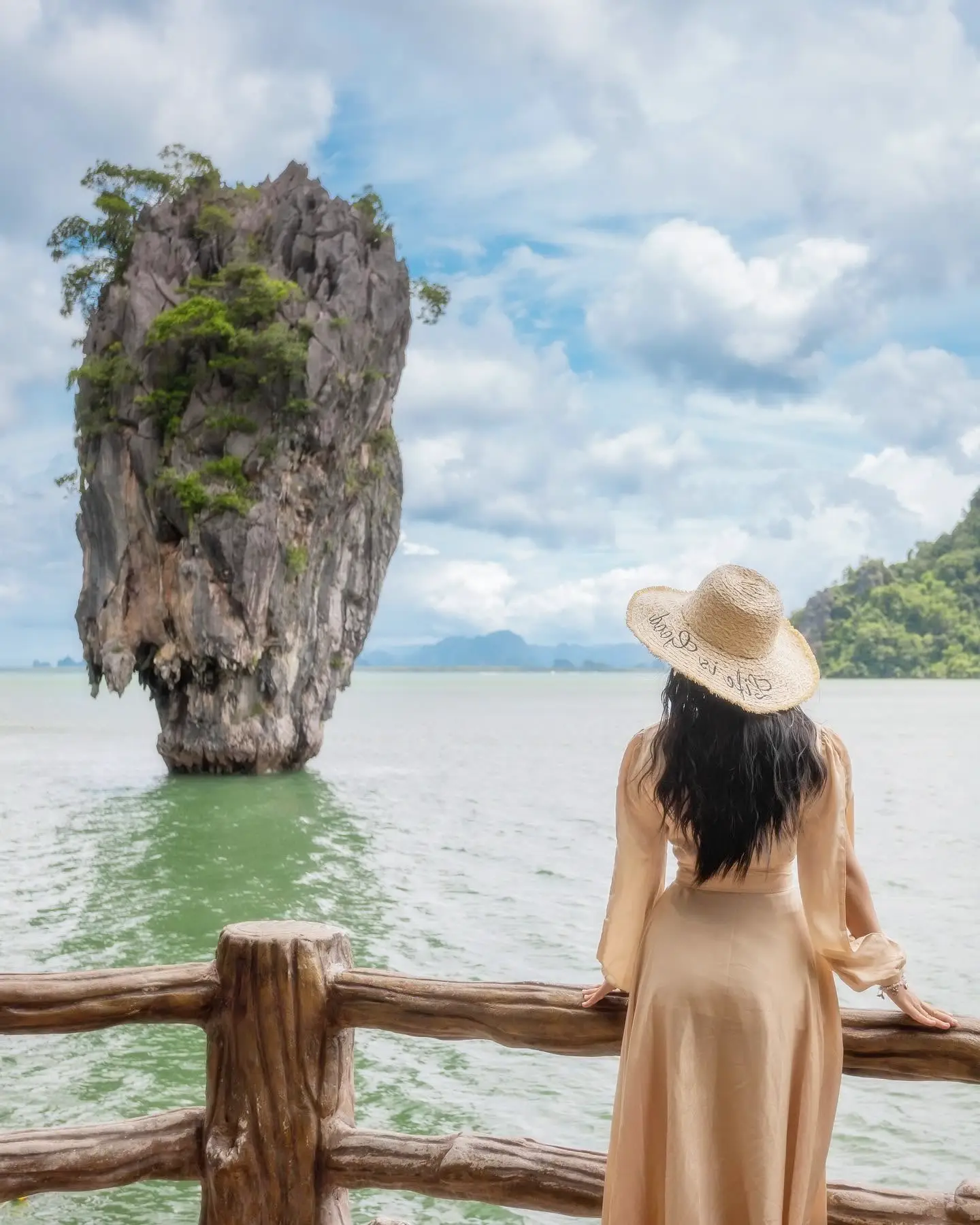 Traveler viewing James Bond Island in Phang Nga Bay on a speed catamaran tour from Phuket