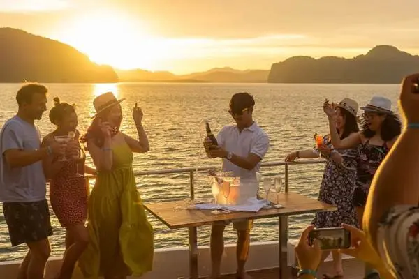 Travelers relaxing on a luxury catamaran during the James Bond Island tour in Phang Nga Bay