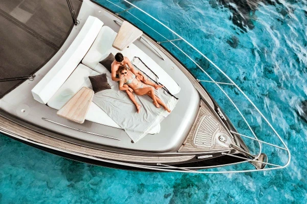Guests relaxing on the bow of a first-class luxury yacht during a Phuket island tour