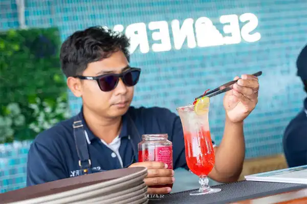 Drink service aboard a luxury catamaran during the James Bond Island tour