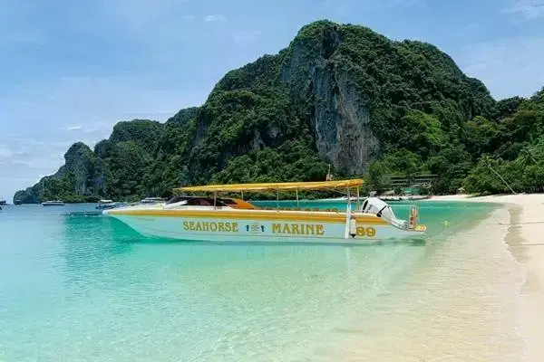 James Bond Island sunset tour speedboat at a tropical beach in Phang Nga Bay