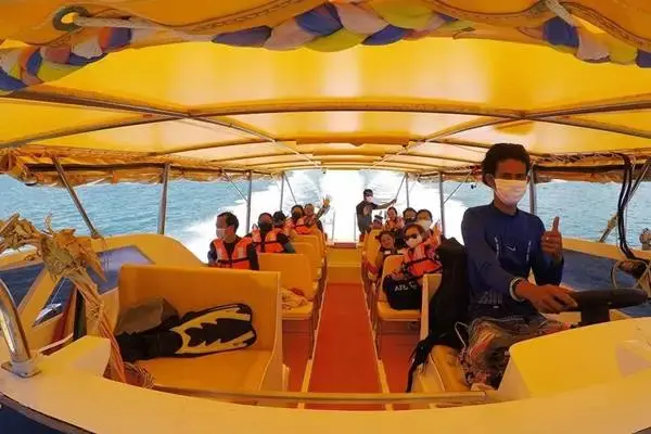 Passengers aboard the speedboat on a James Bond Island sunset tour from Phuket