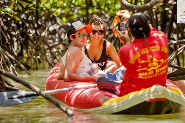 Couple enjoying sea cave canoeing in Phang Nga Bay on the James Bond Island sunset tour from Phuket