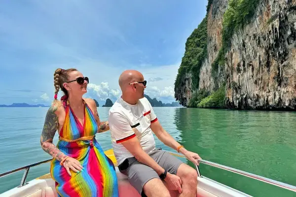 Couple enjoying a speedboat ride through Phang Nga Bay on the James Bond Island sunset tour from Phuket