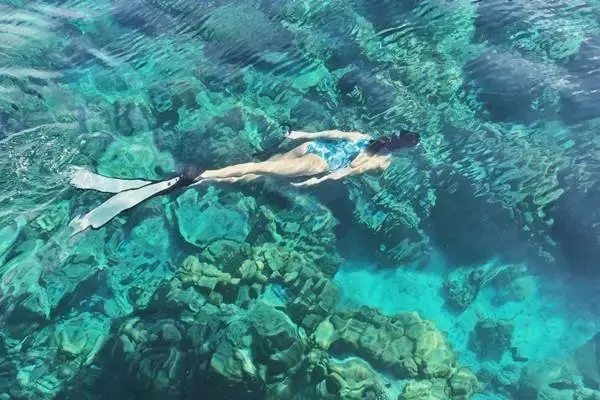 Snorkeling in clear tropical water near Phi Phi Don Island on Phi Phi James Bond Krabi 2 day tour