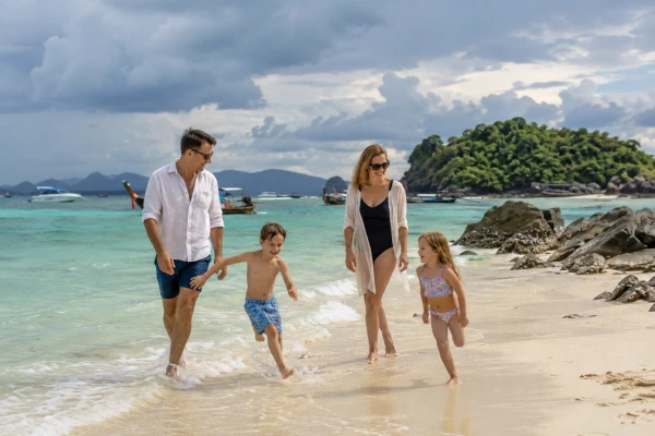 Family visiting Khai Island during the wetter season from August to October
