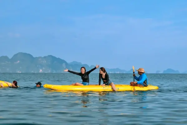 Guests kayaking and swimming during the James Bond Island Afternoon Tour from Phuket in Phang Nga Bay