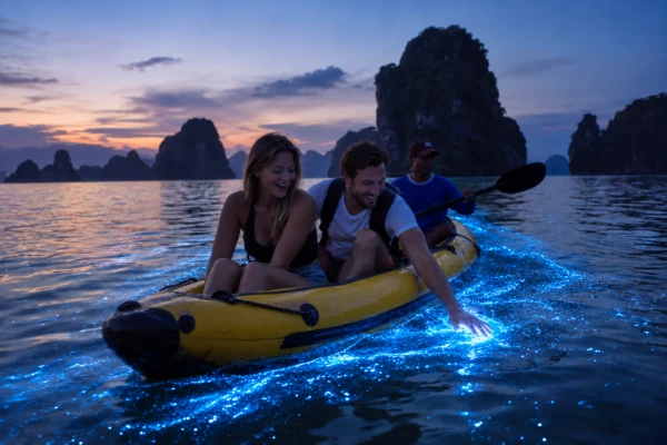 Young couple watching bioluminescent plankton while canoeing during the James Bond Island Afternoon Tour from Phuket