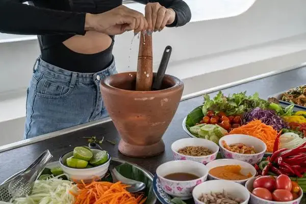 Thai food preparation on board during the James Bond Island Afternoon Tour from Phuket