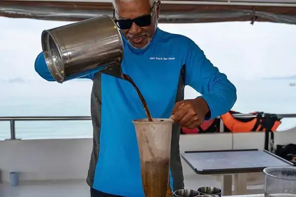 Tour staff preparing drinks on board during the James Bond Island Afternoon Tour from Phuket