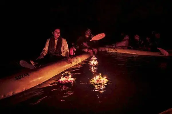 Guests floating Krathongs by canoe inside a cave during the James Bond Island Afternoon Tour from Phuket