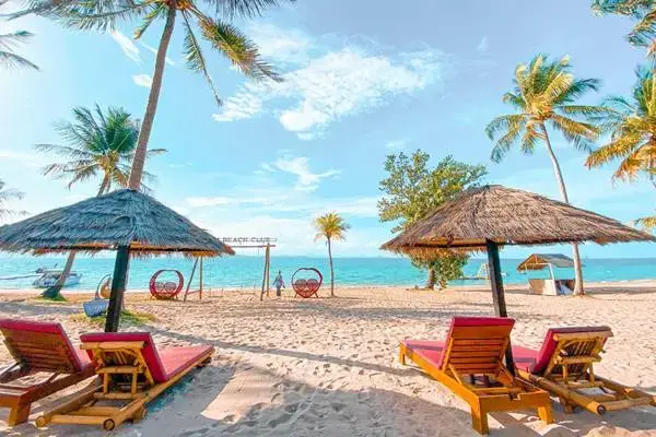Beach chairs and umbrellas on Koh Yao Yai during the James Bond Island late morning tour from Phuket