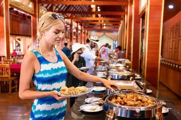 Guest enjoying a buffet lunch at Panyee Island during the James Bond Island late morning tour from Phuket