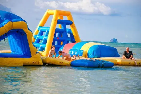 Floating water activities at a beach club on Koh Yao Yai during the James Bond Island late morning tour from Phuket
