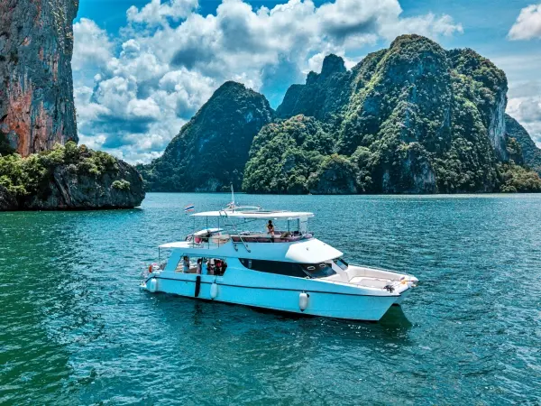 James Bond Island luxury power catamaran cruising through Phang Nga Bay from Phuket