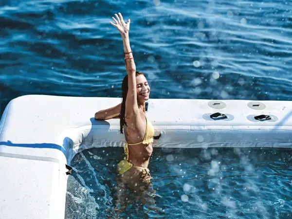 Guest enjoying the floating pool during the James Bond Island luxury power catamaran tour from Phuket