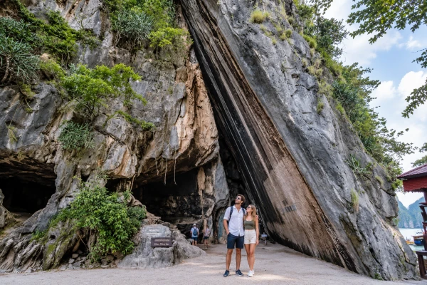 Couple visiting Khao Phing Kan at James Bond Island during a sunrise tour from Phuket