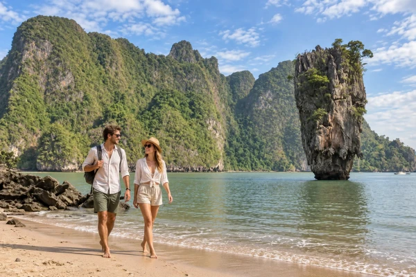 Couple visiting James Bond Island before the crowds during the James Bond Island Sunrise Tour from Phuket