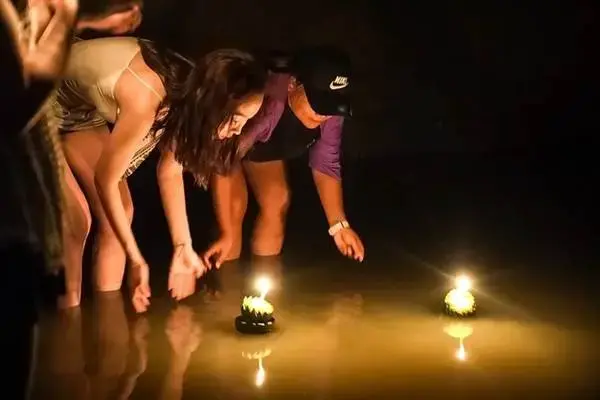 Guests floating Loy Krathong during the James Bond Island Sunset Plankton Tour in Phang Nga Bay