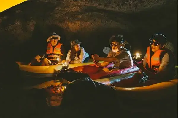 Guests enjoying nighttime canoeing in Phang Nga Bay during the James Bond Island Sunset Plankton Tour